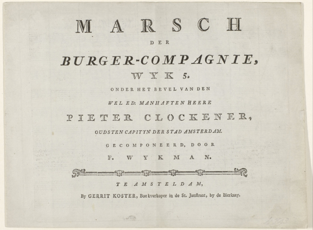 Papier mit handgeschriebenem Text "Marsch der Burger-Compagnie, WK 5" darauf.